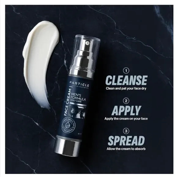 Particle Men's Formula Face Cream bottle shown on a dark marble background with a smear of white cream and three-step application instructions: Cleanse, Apply, and Spread.